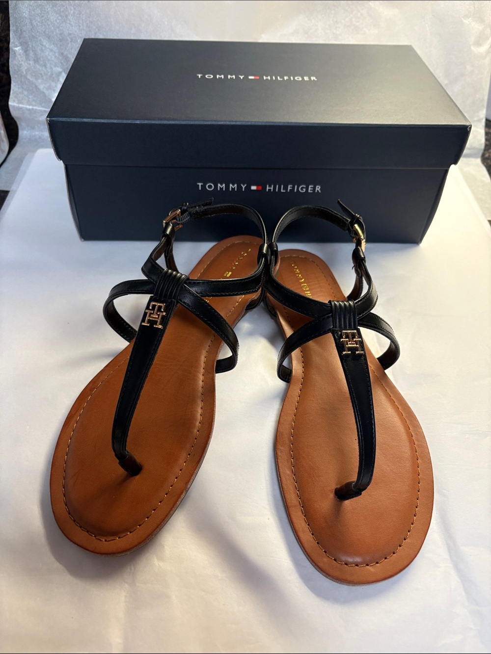 Tommy Hilfiger Black Leather T-Strap Sandals with Tan Footbed and Gold Logo